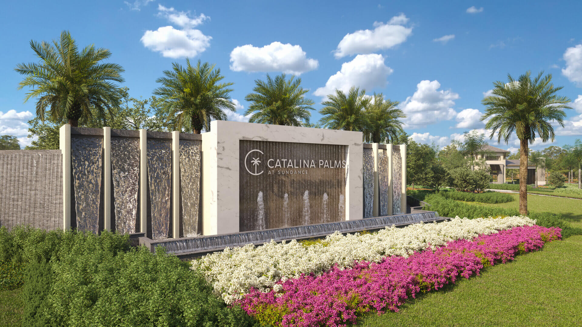 A landscaped garden with colorful flowers and palm trees, enhanced by a large modern water fountain displaying the words "Catalina Palms," creates a vibrant oasis perfect for 55+ active adults in Port St. Lucie.