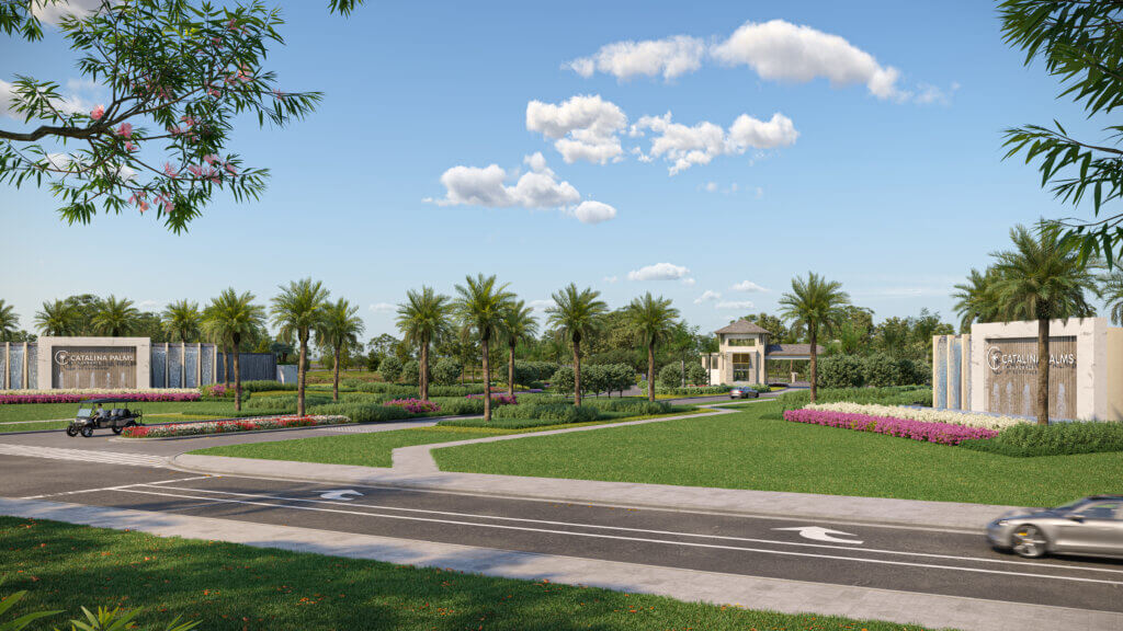A landscaped entryway with a road in the foreground, lush green lawns, palm trees, and flower beds. Signs on either side read "Golden Park." A small building is visible in the background under a blue sky with scattered clouds.